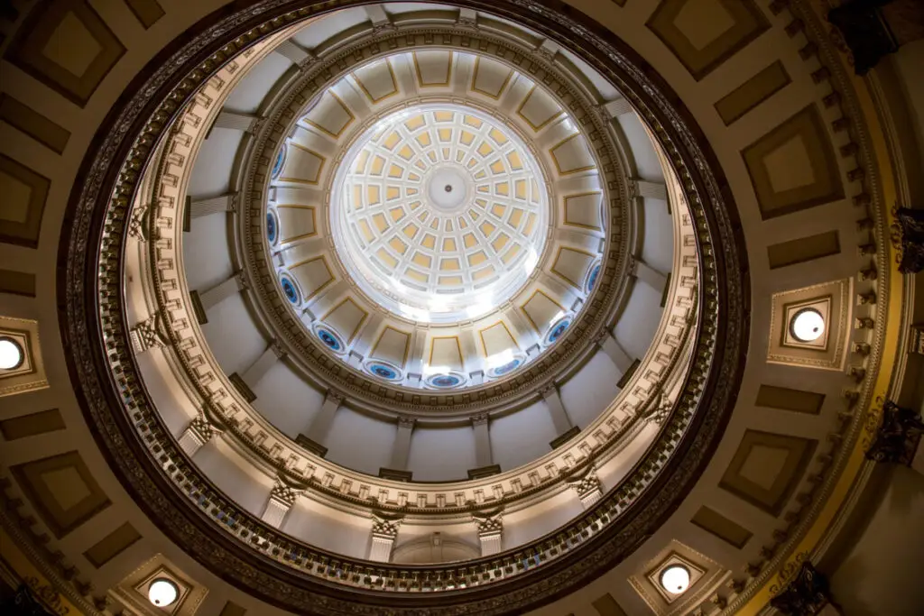 A photo from inside the Colorado State Capitol looking up at the capitol dome.