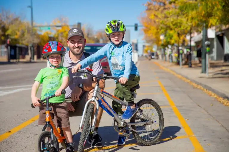 Adult with two kids on bikes