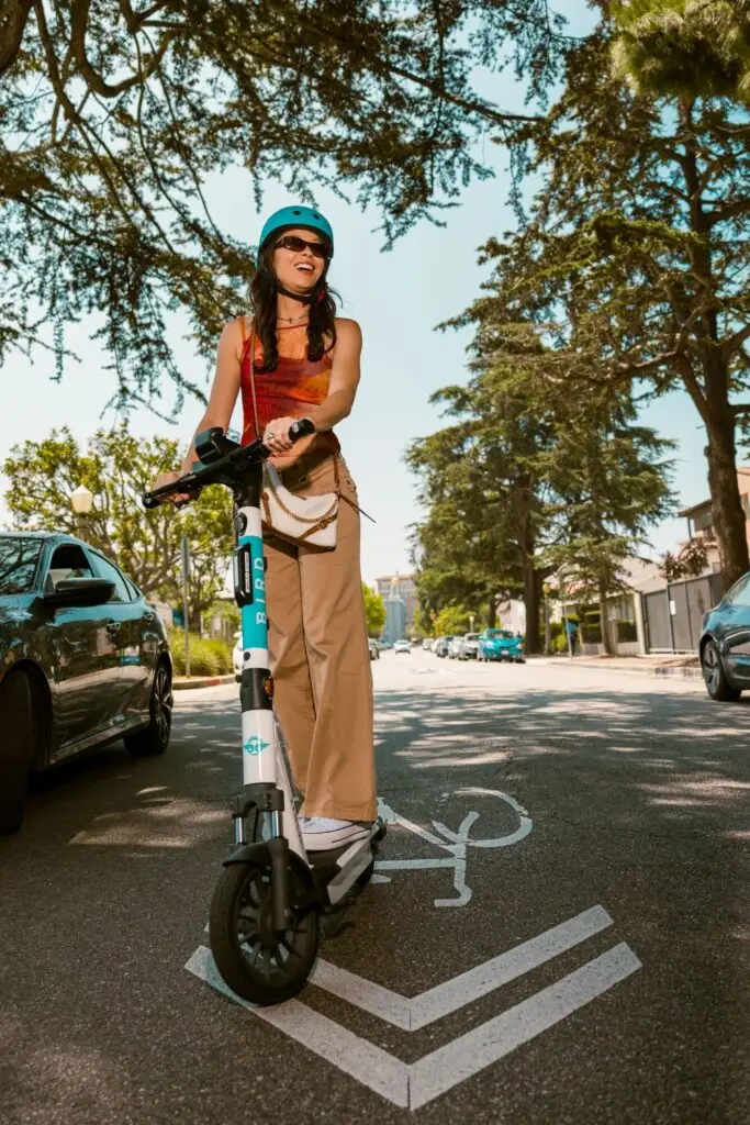 Woman on Bird scooter