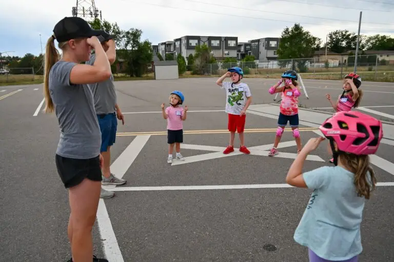 Group of kids learning bike helmet safety