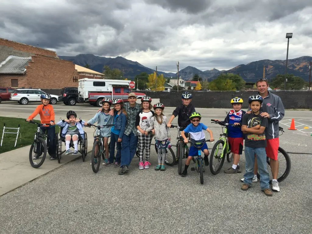 Youth bikers in front of school
