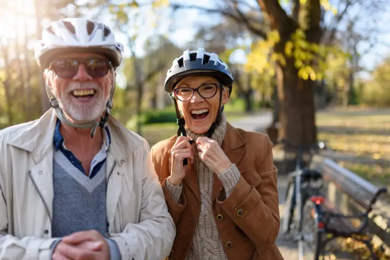 Active seniors with bike helmets on