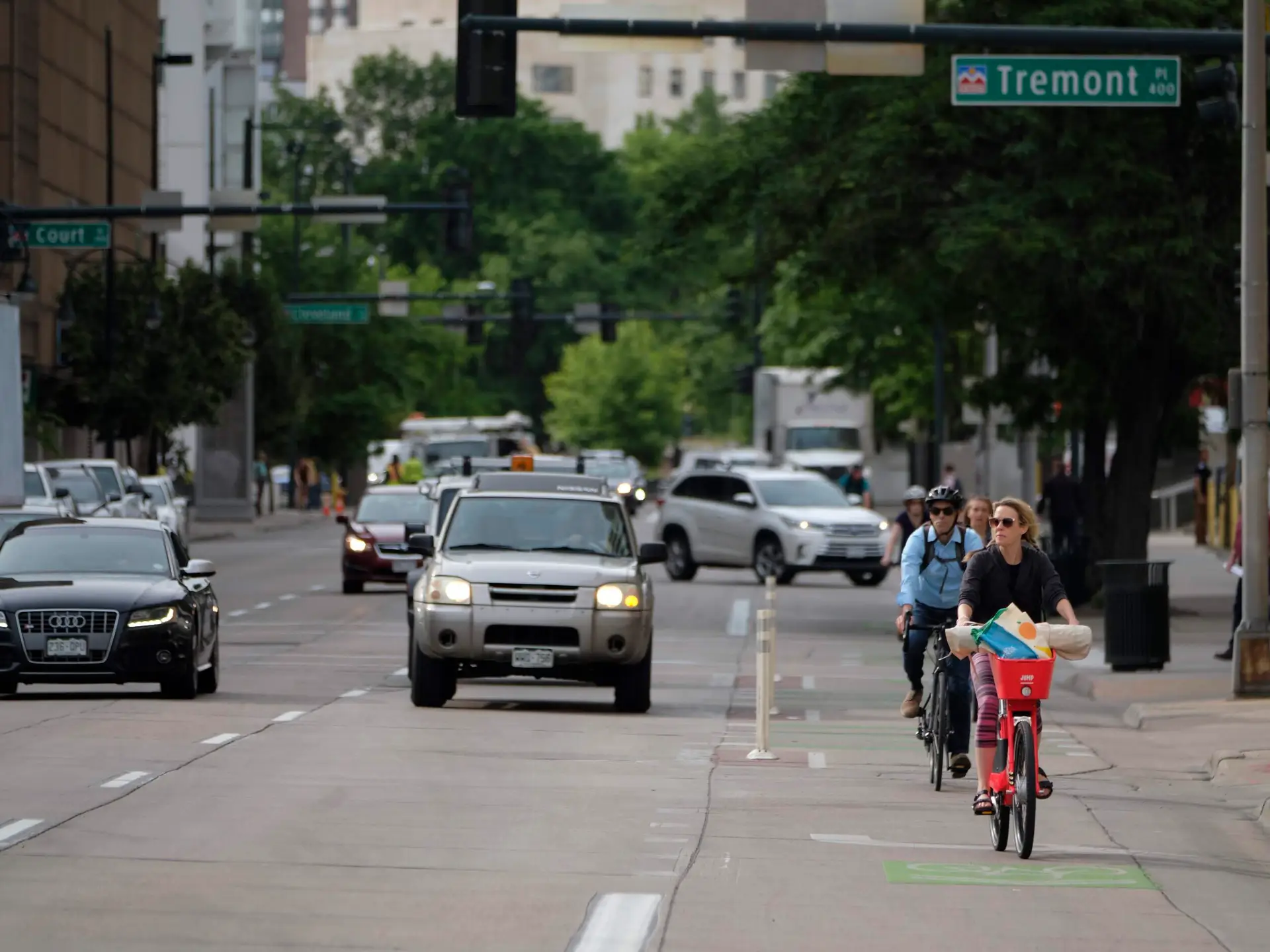 Bicyclists and cars on the road