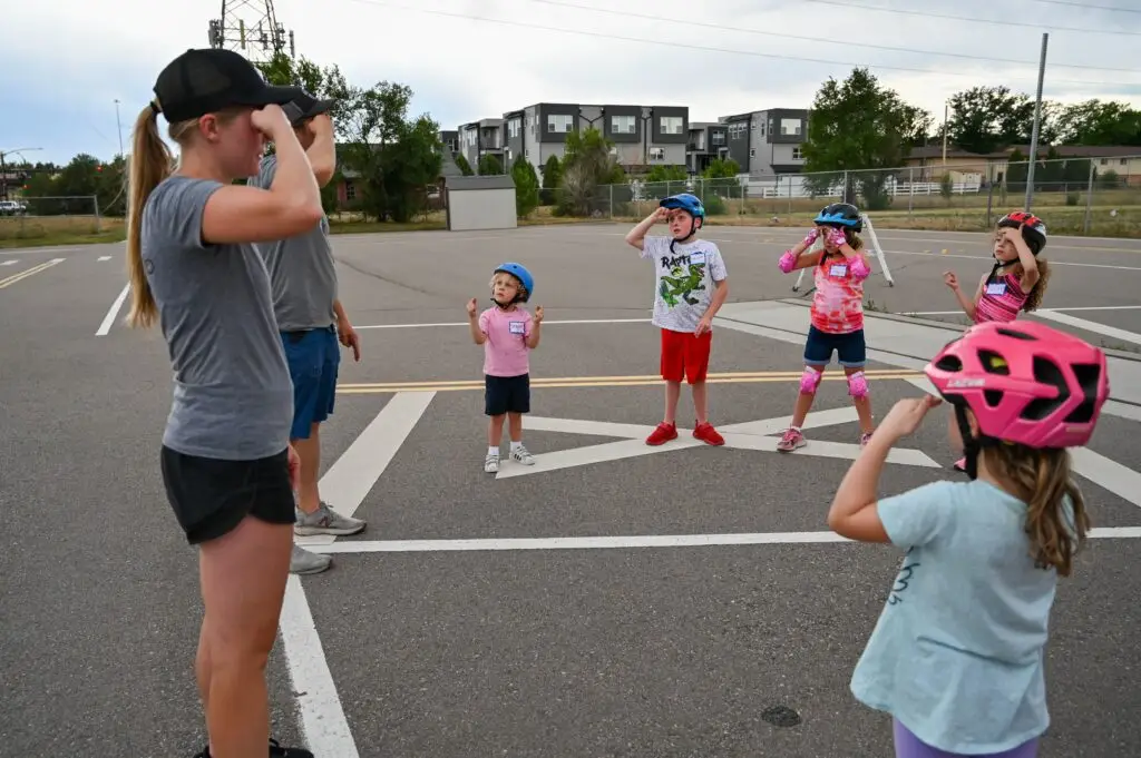 Education volunteers work with youth bicyclists