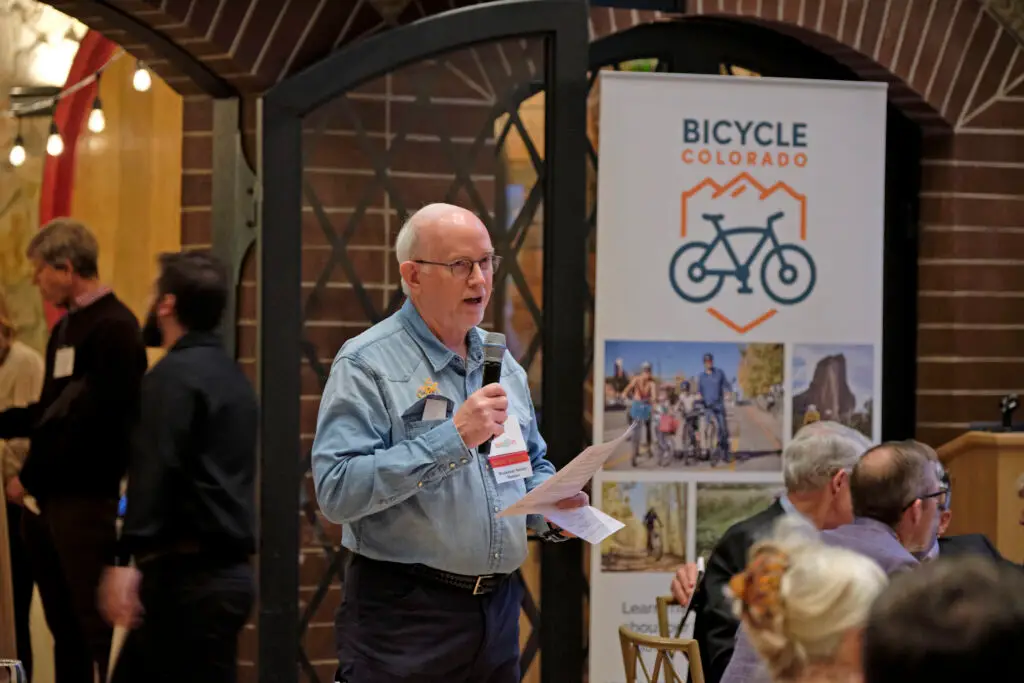 Board member speaks at an event.