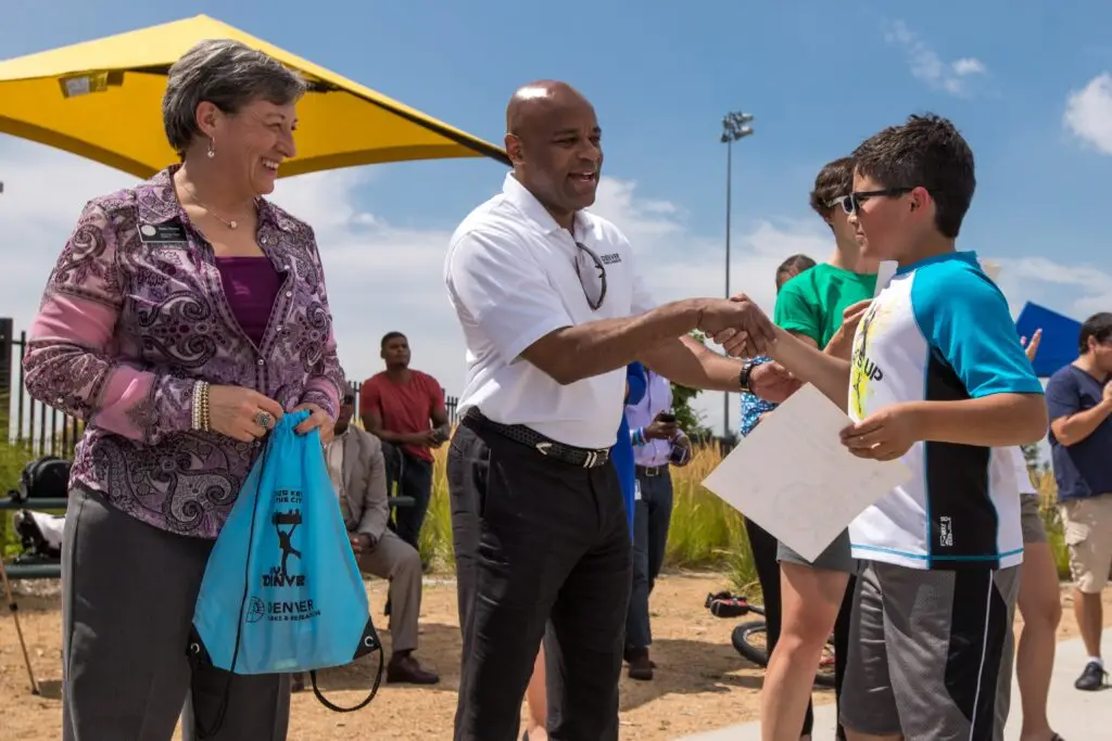 Community members talk to youth