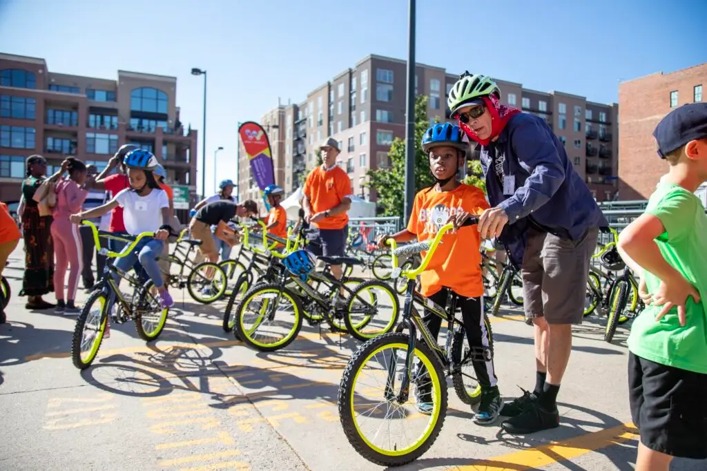 Youth are fitted with bikes and helmets