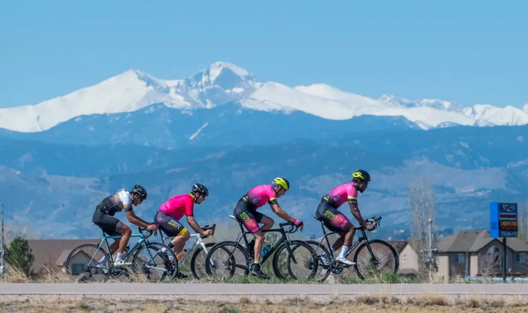 Bicyclists ride together on the road