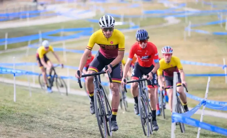 College bicyclists ride in a race together