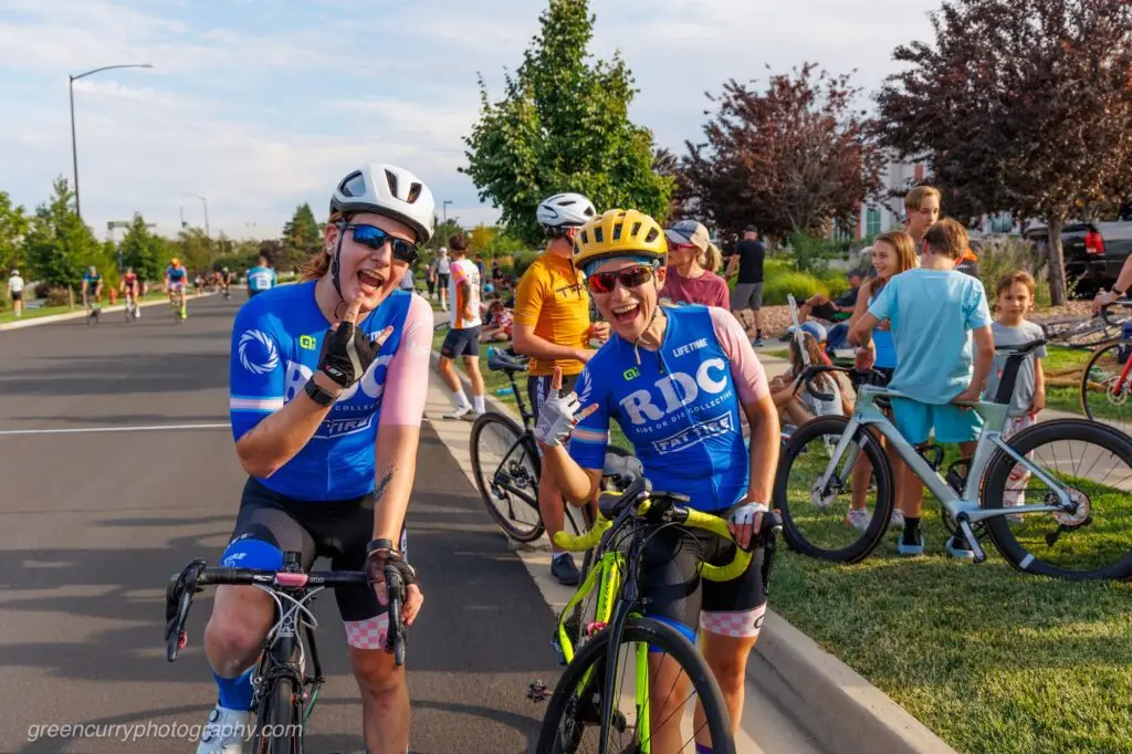 Two bicyclists gather together