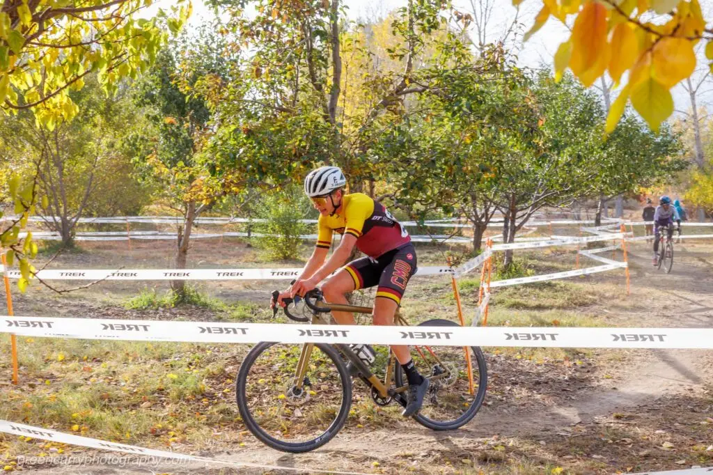A college bicyclist rides in a race