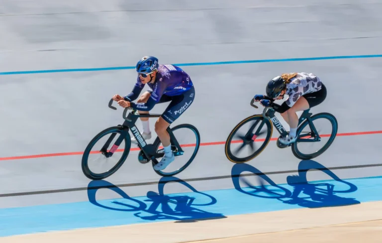 Bicyclists ride on velodrome track