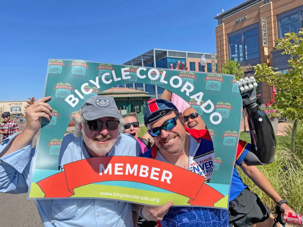 Bicycle Colorado members with sign