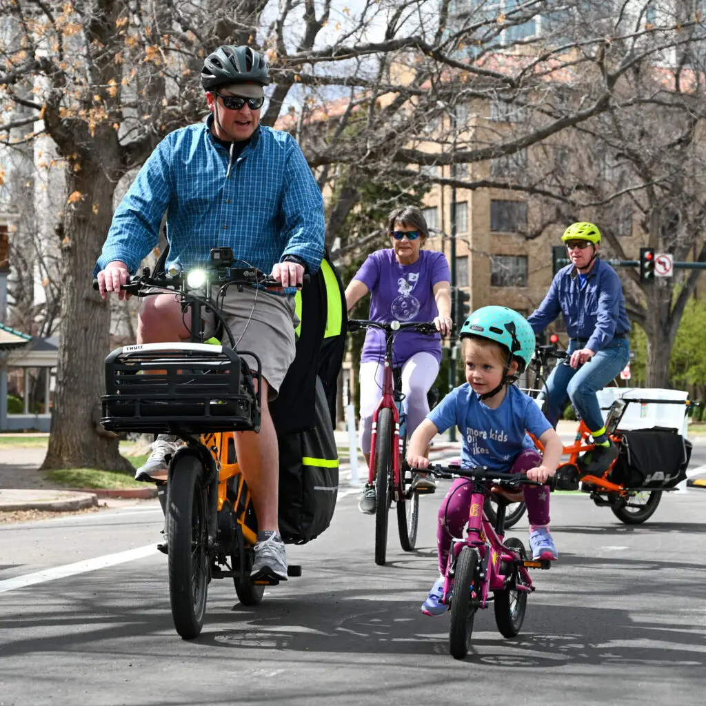 Father and daughter riding bikes