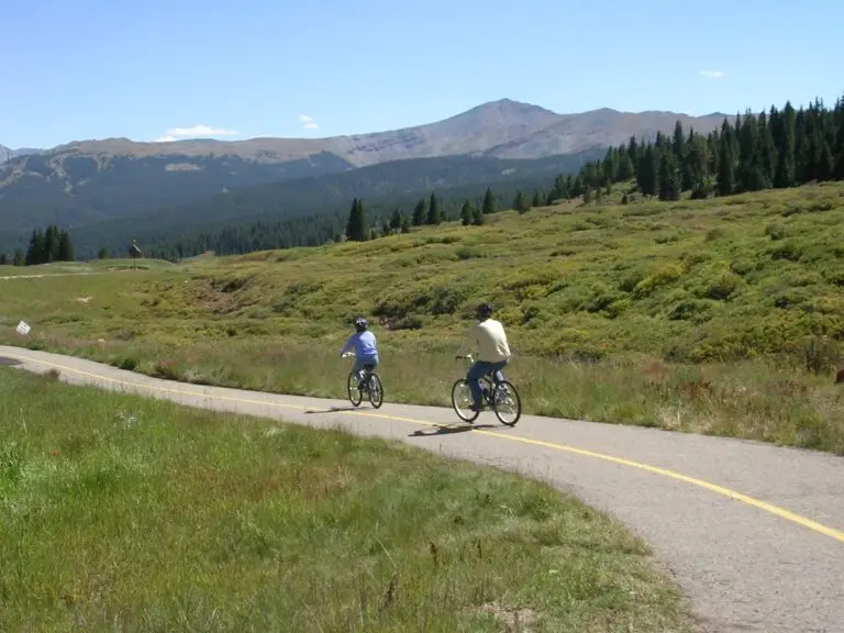Bicyclists ride on a path