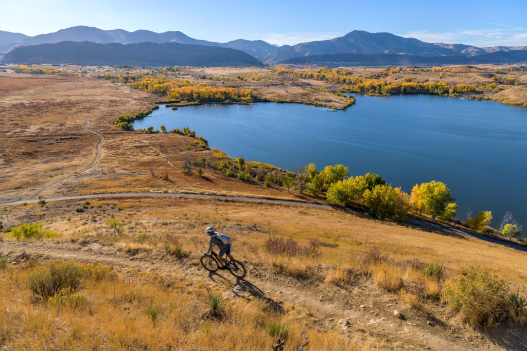 A bicyclist rides on a trail